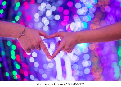Two hand making heart shape with bokeh light background, Happy Valentine's Day.