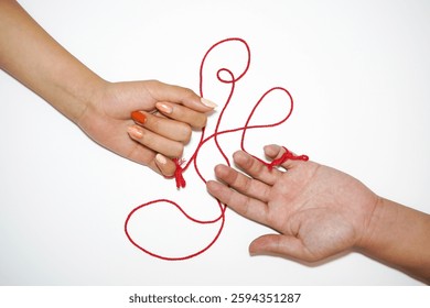 Two hands connected by a red string, symbolizing destiny and the invisible bond between people. Inspired by the East Asian 