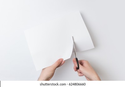 Two Hands Cutting Paper