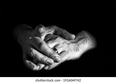 two hands in the darkness