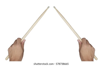 Two hands of drummer holding drum sticks isolated on white in ready position to play drum