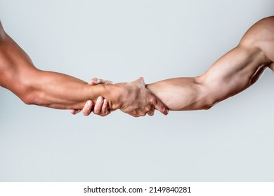 Two hands, helping arm of a friend, teamwork. Helping hand concept and international day of peace, support. Closeup. Helping hand outstretched, isolated arm, salvation. Close up help hand. - Shutterstock ID 2149840281