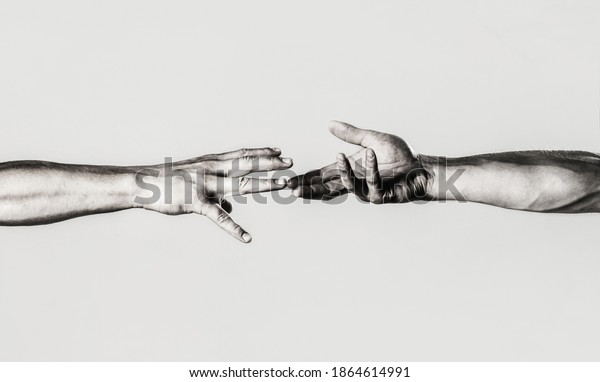 Two hands, helping arm of a friend, teamwork.\
Rescue, helping gesture or hands. Close up help hand. Helping hand\
concept, support. Helping hand outstretched, isolated arm,\
salvation. Black and white.