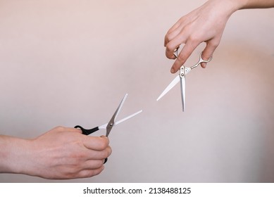 Two Hands Holding Hair Scissors. Hairdresser Tools. 