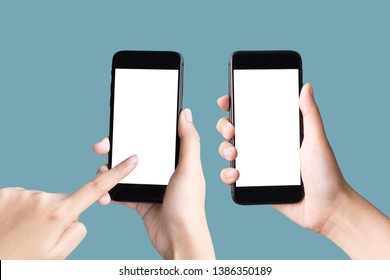 Two Hands Holding And Playing Smart Phones On Pastel Background With Clipping Path