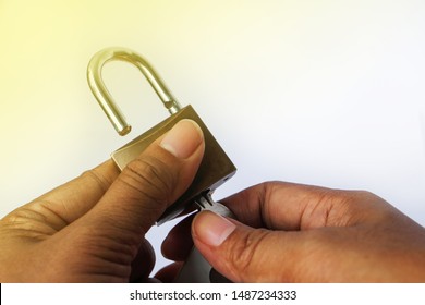 Two hands holding to unlock the key
