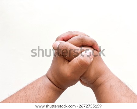 Two hands interlocked conveying strength unity and human connection symbolizing support against a bright backdrop. A powerful visual representing cooperation empathy and resilience.