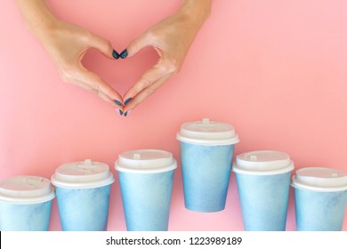 Two Hands Making Heart Between Many Paper Cups Of Coffee . Coffee, Love Concept. 