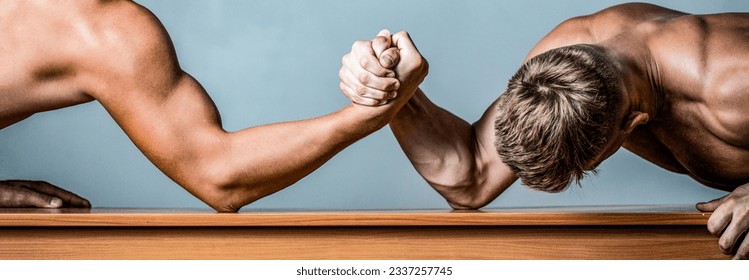Two hands. Men measuring forces, arms. Hand wrestling, compete. Hands or arms of man. Arm wrestling. Two men arm wrestling. Rivalry, closeup of male arm wrestling.