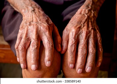 Two hands of an old man.