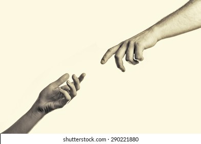  two hands reaching toward each other - Shutterstock ID 290221880