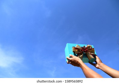 Two hands to send gift boxe - Shutterstock ID 1589565892