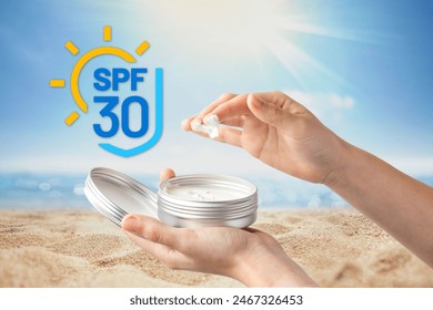 Two hands are shown applying sunscreen from a tin container with a graphic indicating SPF 30 against a sunny beach backdrop