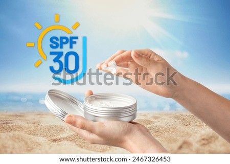 Two hands are shown applying sunscreen from a tin container with a graphic indicating SPF 30 against a sunny beach backdrop