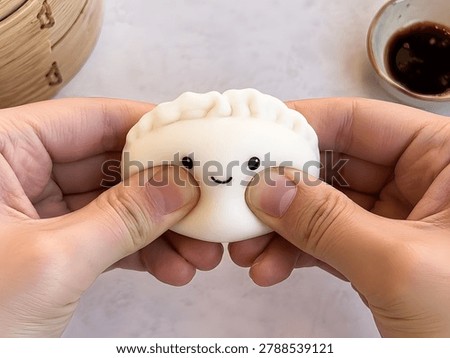 Two hands squeezing squishy dumpling toy, kawaii food concept, trendy collectible toys