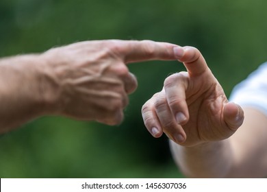 Two Hands Touching, Two Men Touch Their Finger, Concept The Global Gender Gap 