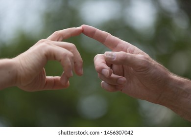 Two Hands Touching, Two Men Touch Their Finger, Concept The Global Gender Gap