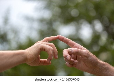 Two Hands Touching, Two Men Touch Their Finger, Concept The Global Gender Gap 