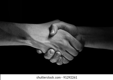 Two hands unite with eachother as deal agreement