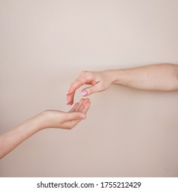 Two Hands. Woman And Boy Arms Reaching Each Other. Family Support And Care.