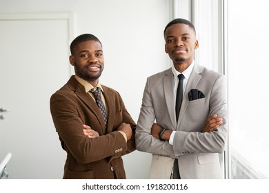 Two Handsome African Men In Suits At The Office 