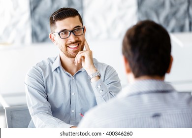 Two Handsome Businessmen In Office