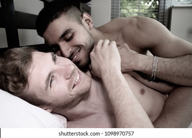 Two Handsome Gay Men, In Bed Together Tickling And Making Each Other Laugh