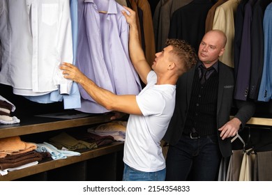 Two Handsome Guys. Young Gay Couple In The Store Buy Clothes.