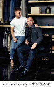 Two Handsome Guys. Young Gay Couple In The Store Buy Clothes.