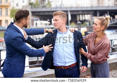 two handsome men fighting while a woman is trying to intervene