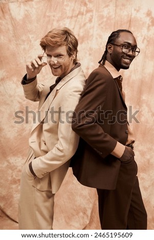 Two handsome multicultural men with elegant dapper style posing together.