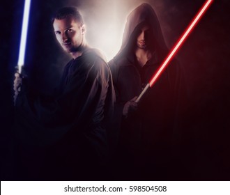 Two Handsome Warrior Holding A Light Saber 