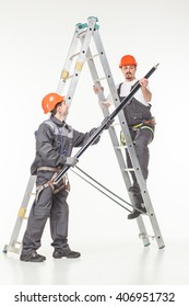 Two handymen at work stair white background