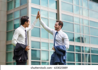 Two Happy Adult Business Men High Fiving