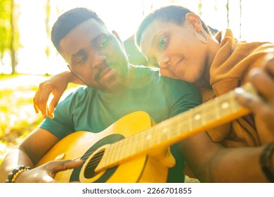 two happy african american people in love spending time outdoors in camp - Powered by Shutterstock