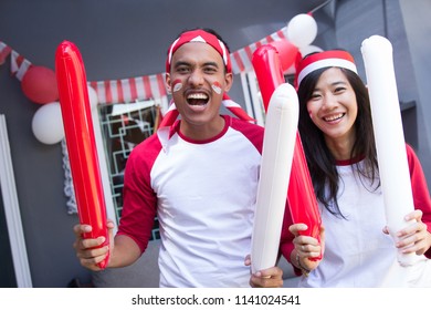 Two Happy Asian People Celebrating Indonesia Independence Day