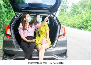 Two Happy Asian Woman Wearing Protective Mask Sitting On Hatchback Car Hand Holding Coffee Cup Travel With New Normal Lifestyle 