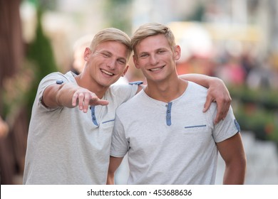 The two happy and attractive twin outdoor