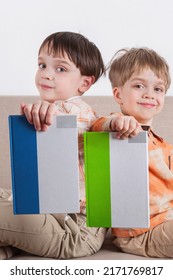 Two Happy Boys Holding Their Book. Mokap Books