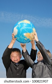 Two Happy Boys Wear In Suits Holding The Globe Together