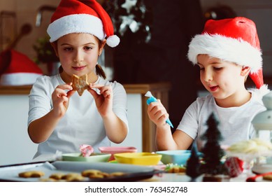 Two Happy Children Decorating Cookies For Holidays At Home