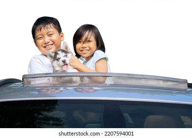 Two Happy Children Embracing Their Dog On The Sunroof Of Car While Enjoying Road Trip. Isolated On White Background