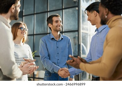 Two happy diverse professional business men executive leaders shaking hands at office meeting. - Powered by Shutterstock