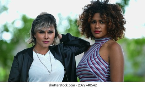 Two Happy Diverse Women Standing Outside Smiling