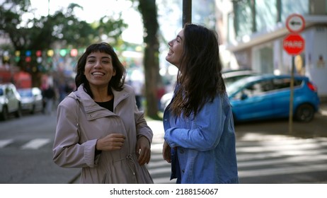 Two Happy Female Friends Dancing Outside In City Street Celebrating Life. Happy Women Dancers