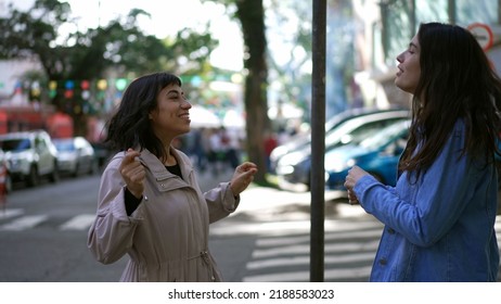 Two Happy Female Friends Dancing Outside In City Street Celebrating Life. Happy Women Dancers