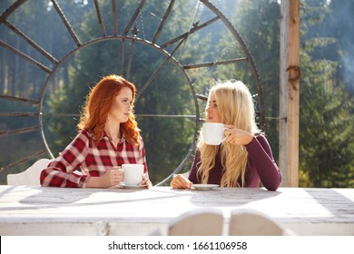 Two happy friends talking outside in a house terrace  at sunset - Powered by Shutterstock