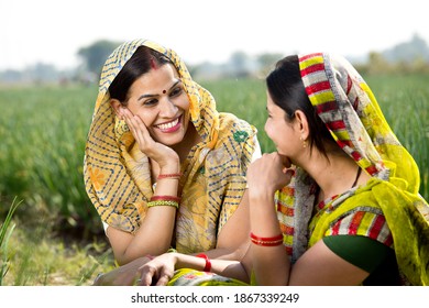 Two Happy Indian Rural Women Talking On Agricultural Field