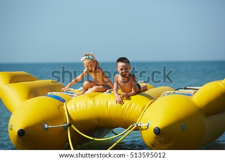 two happy kids playing on the boat at summer day
