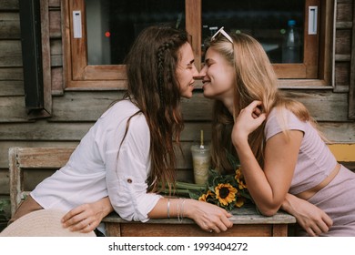 Two Happy Lesbians Have A Date In Outdoor Cafe